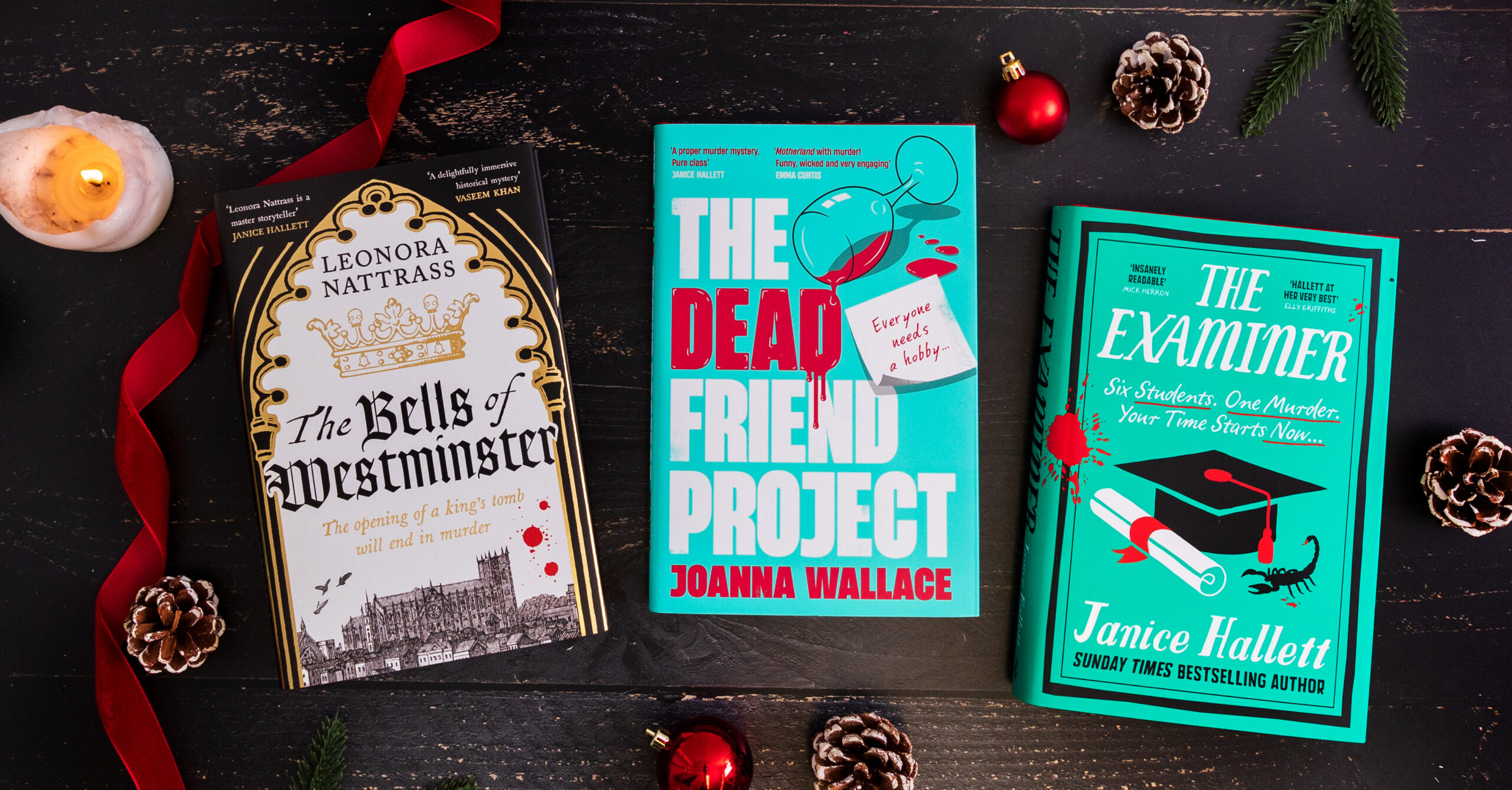 A top-down photograph featuring three Viper books with Christmas decorations surrounding them. The books are: The Examiner, The Bells of Westminster, The Dead Friend Project.